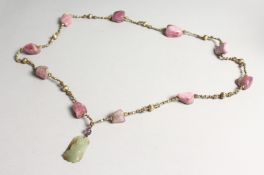 A 19TH CENTURY CHINESE QING DYNASTY CARVED JADE PENDANT NECKLACE with Touraline beads.
