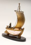 AN UNUSUAL LATE 19TH CENTURY FRENCH ORMOLU MOUNTED SHELL, mounted as a small sailing dinghy, a