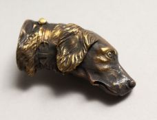 A BRASS SPORTING DOG'S HEAD VESTA 2ins long.