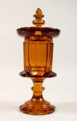 A PERSIAN MARKET AMBER GOBLET AND COVER