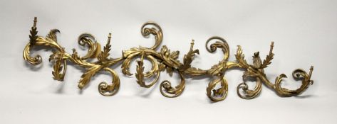 AN 18TH CENTURY ORMOLU EIGHT LIGHT SCONCE, with scrolling arms and acanthus 4ft long, 1 ft deep