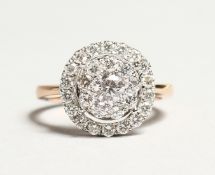 A GOOD 18K GOLD DIAMOND CIRCULAR CLUSTER RING