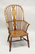 A 19TH CENTURY YEW, BEECH AND ELM WINDSOR ARMCHAIR