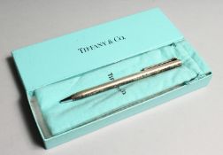 A TIFFANY SILVER PEN in a Tiffany box.