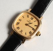 A LADIES VERY GOOD GOLD OMEGA WRIST WATCH with leather strap.