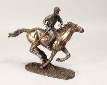 A SMALL, PART COLOURED METAL AND COMPOSITE, MODEL OF A MOUNTED POLO PLAYER ON THE GALLOP. 12ins