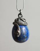 A SMALL SILVERED LAPIS PENDANT with a snake
