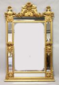 A LARGE CLASSICAL STYLE GILT FRAMED PIER MIRROR with a central rectangular mirror plate within six