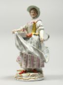 A GOOD MEISSEN PORCELAIN FIGURE OF A GARDENERESE, holding a sickle, carrying a basket of flowers, an