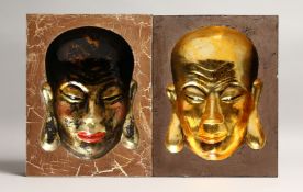 A PAIR OF CHINESE WOODEN PORTRAIT PICTURES with inset heads in gilt 12ins x 9.5ins