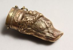 A BRASS SPORTING DOG'S HEAD VESTA 2.5ins long.