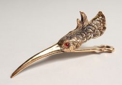 A BRASS SNIPE'S HEAD PAPER CLIP 5ins long