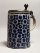 A LARGE GERMAN WESTERWOLD TANKARD, with pewter lid and geometric decoration 9.5ins high