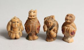 FOUR CARVED BONE NETSUKES