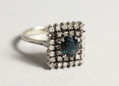 A 18CT WHITE GOLD DIAMOND AND SAPPHIRE RING.