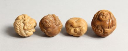 FOUR CARVED BONE NETSUKES.