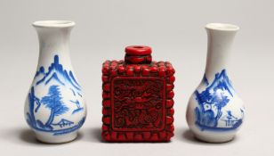 A SMALL PAIR OF CHINESE BLUE AND WHITE VASES 3ins high and a cinnabar snuff bottle.