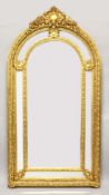 A LARGE AND IMPRESSIVE ARCH TOP GILT FRAMED MIRROR, the central arch shaped mirror plate with six