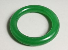 AN APPLE JADE BANGLE 3.25ins diameter