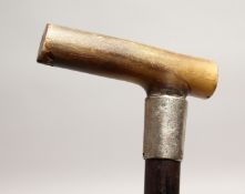 A GOOD 19TH CENTURY RHINO HANDLE WALKING STICK with silver band Birmingham 1878.