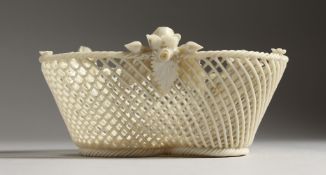 A BELLEEK PORCELAIN TREFOIL SHAPED PIERCED BASKET 5.25ins wide.