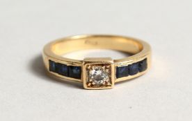 AN 18CT GOLD DIAMOND AND SAPPHIRE RING