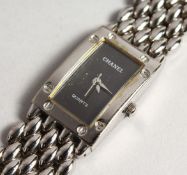 A 1980'S CHANEL WRIST WATCH AND BRACELET No. U. B. 45001 in original Chanel box