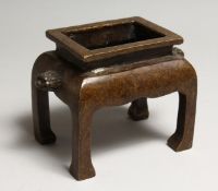 A CHINESE BRONZE RECTANGULAR CENSOR, on four curving legs 5.5ins long