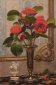Fortunio Matania (1881-1963) Italian, A still life of red flowers and an ornament on a marble table,