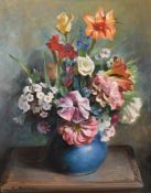 Charles A. Buchel (Exhib. 1895-1935), A still life of flowers in a blue vase, oil on board,
