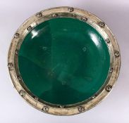 AN EARLY EASTERN GREEN GLAZED & WHITE METAL LARGE POTTERY DISH, the large dish glazed with a green