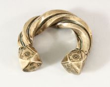 A SEJLUK WHITE METAL TWISTED BANGLE, The lower with a hall mark OR makers mark. 8cm