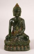 A THAI CARVED GREEN HARDSTONE BUDDHA, 13cm high.