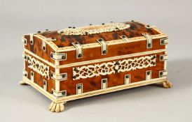 A SMALL VISAKHAPATNAM TORTOISESHELL AND IVORY SANDLEWOOD CASKET, stood on four carved ivory claw