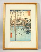 A JAPANESE WOODBLOCK PRINT, after Hiroshige, depicting figures on a bridge, 29cm x 19cm.