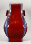 A GOOD CHINESE FLAMBE TWO HANDLE TAPERING BULBOUS VASE, impressed six character mark to base, 31cm