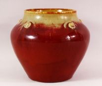 A CHINESE FLAMBE PORCELAIN JAR / VASE - with a graduating flambe glaze with raised stud boss