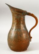 A 19TH CENTURY PERSIAN QAJAR COPPER JUG, 24.5cm high.