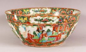 A 19TH CENTURY CHINESE CANTON FAMILLE ROSE PORCELAIN BOWL - with panel decoration of figures, flora,