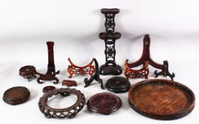 AN UNUSUAL TALL CHINESE PIERCED AND CARVED TWO TIER HARDWOOD STAND, 40cm high, together with various