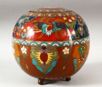 A CHINESE CLOISONNE JAR AND COVER, decorated with phoenix and floral motifs, supported on three