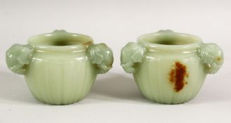 A GOOD SMALL PAIR OF CARVED JADE CIRCULAR RIBBED CENSERS, with three elephant formed handles, 8cm
