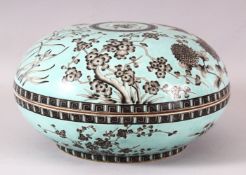 A LARGE CHINESE TURQUOISE GROUND CIRCULAR BOX AND COVER, the exterior decorated with flowers, the