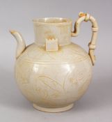 AN UNUSUAL CHINESE DING STYLE POTTERY TEA POT, with incised floral motifs, 15cm high x 14cm wide.