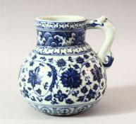 A CHINESE MING STYLE BLUE AND WHITE WINE JAR, decorated with lotus flowers, the handle in the form