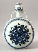 A CHINESE BLUE AND WHITE PORCELAIN TWIN HANDLE MOONFLASK, the body painted with stylised flowers,