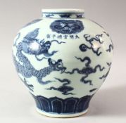 A CHINESE MING STYLE BLUE AND WHITE DRAGON JAR, decorated with a dragon chasing the flaming pearl of
