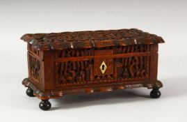 A CHINESE CANTON CARVED WOOD BOX, the lid carved with a panel containing a landscape setting and