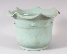 A CHINESE SONG STYLE CELADON PLANT POT, with circular script to base, 18cm diameter, 13cm high.