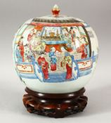 A GOOD CHINESE FAMILLE ROSE PORCELAIN JAR AND COVER on a hardwood stand, the jar painted with